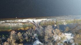 Lightweight coal combustion byproducts could be seen Friday, Friday, Sept. 21, 2018 floating on the top of a lake near Wilmington, N.C., and entering the Cape Fear River.