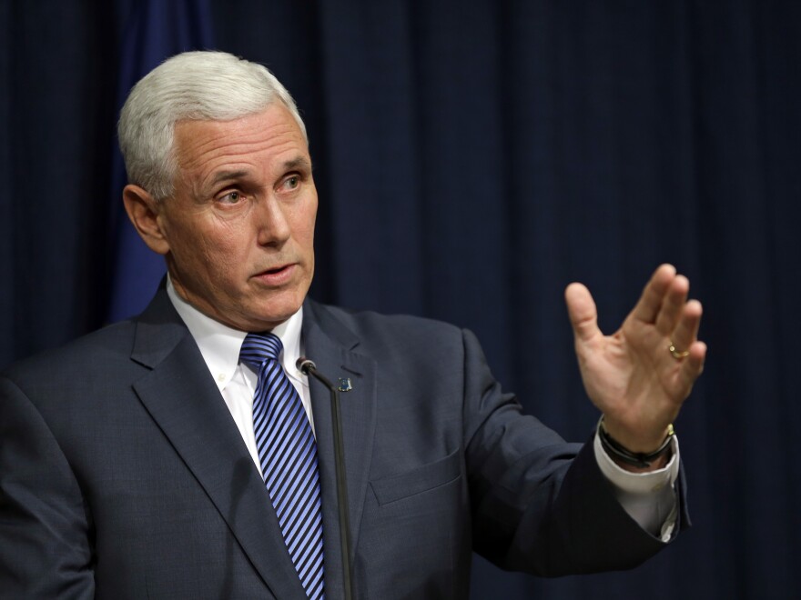 Indiana Gov. Mike Pence holds a news conference at the Statehouse in Indianapolis, on Thursday, where he signed into law a bill that would allow business owners with strong religious convictions to refuse to provide services to same-sex couples.