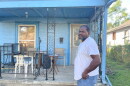 James Mays stands in front of his home in Wyandotte County. He's fighting to keep his property out of the coming tax sale.