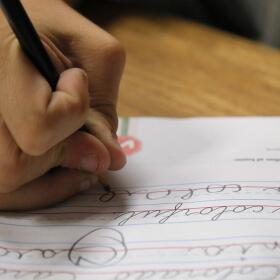 A student practices writing in cursive. (Jae C. Hong/AP)