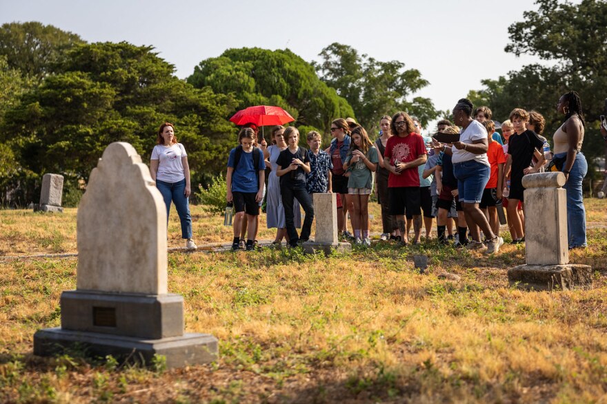 Spears leads a tour for a group of Bethany Cemetery last week.