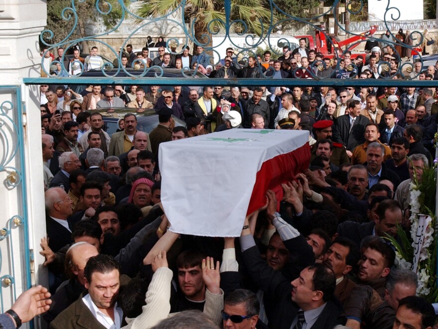 Mourners carry the coffin of filmmaker Moustapha Akkad in Aleppo, Syria, on Nov. 13, 2005. Akkad and his daughter Rima were killed in a suicide bombing in Jordan.