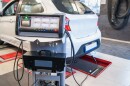 A care receives an emissions test