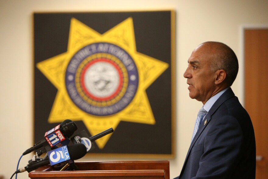 San Bernardino District Attorney Michael Ramos speaks during a press conference in 2018. In an interview with NPR, the now former DA defended police officers, saying that they have an impossible job.