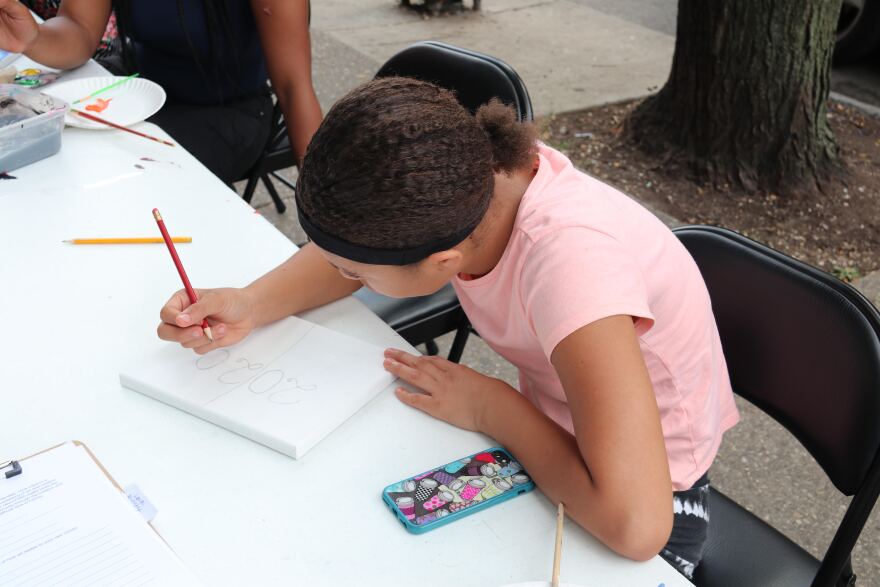 Raemiah, 12, reflected on the year 2020 while creating her contribution to the exhibit.