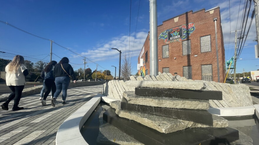 Visitors head toward the ribbon cutting for Lexington's Town Branch Commons Trail on October 13, 2022.