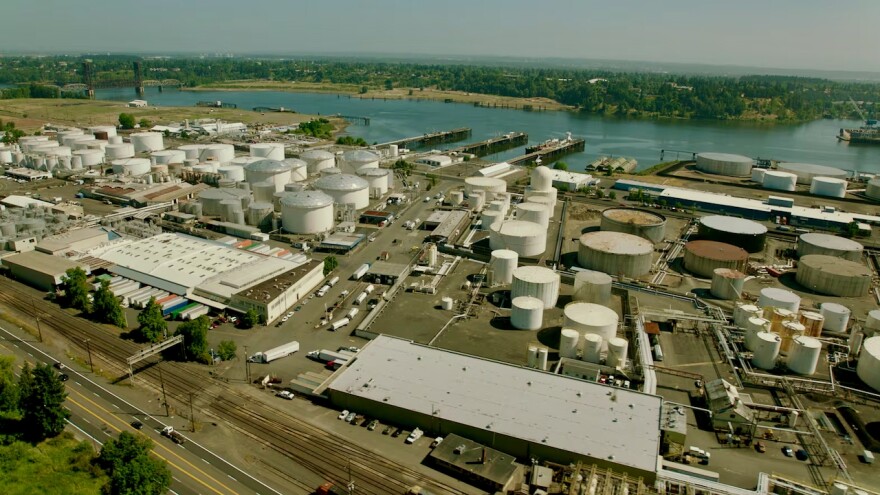 Overhead view of industrial area with tanks and trucks