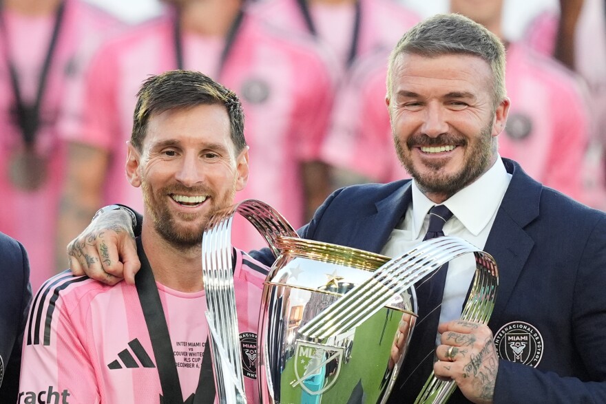 David Beckham poses with the MLS Cup trophy with Inter Miami forward Lionel Messi Saturday, Dec. 6, 2025, in Fort Lauderdale, Fla.