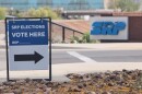 A sign directing voters sits outside the headquarters of Salt River Project on Monday, March 30, 2026, in Tempe, Ariz.