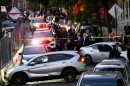 Law enforcement work the scene of a shooting Thursday, Oct. 8, 2026, in New York. (AP Photo/Seth Wenig)