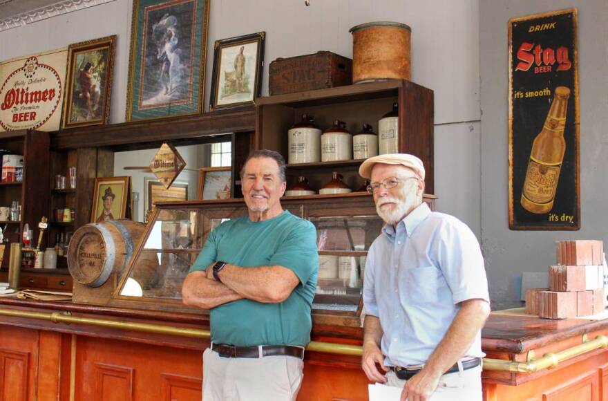 Belleville Historical Society President Larry Betz and Historian Bob Brunkow kick back at the bar of the Historic Garfield Street Saloon museum, which displays artifacts from the old Stag and Star breweries.