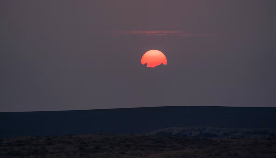 The sun is obscured by wildfire smoke on Aug. 13, 2026.