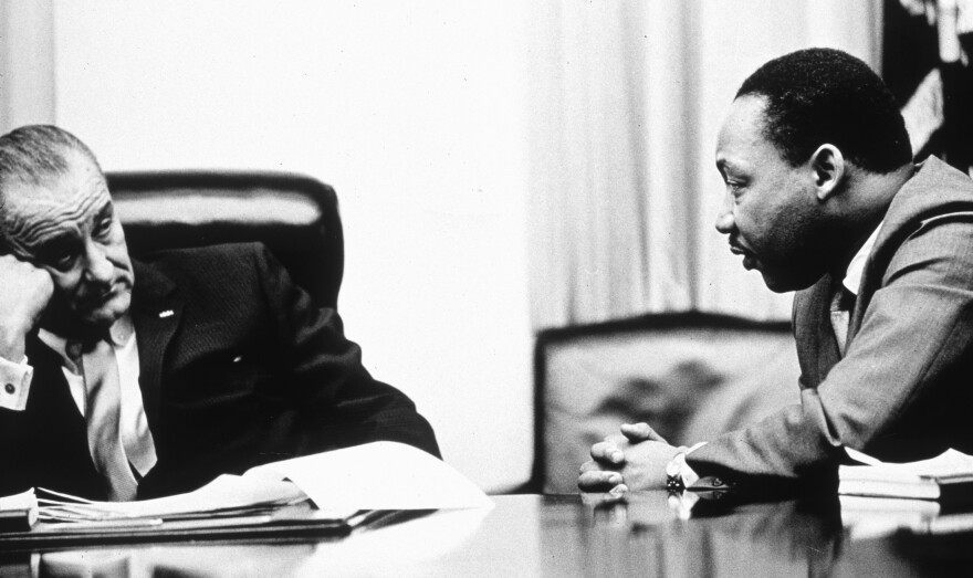President Lyndon Johnson discusses the Voting Rights Act of 1965 with civil rights leader the Rev. Martin Luther King Jr.