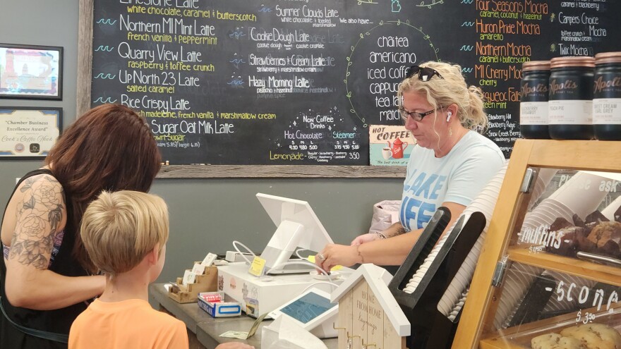 Cooks Coffee Nook owner Cassie Cook takes orders from customers during Nautical City Festival in Rogers City, Michigan on Wednesday, Aug. 13.