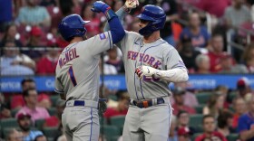 New York Mets' Pete Alonso, right, is congratulated by teammate Jeff McNeil (1) after hitting a two-run home run during the fourth inning of a baseball game against the St. Louis Cardinals Thursday, Aug. 17, 2023, in St. Louis. (AP Photo/Jeff Roberson)