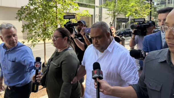 After being arraigned on 11 federal charges, Rep. Francisco Paulino of Methuen walks away from the Moakley Courthouse in Boston on Aug. 26, 2026, as members of the press ask him questions.