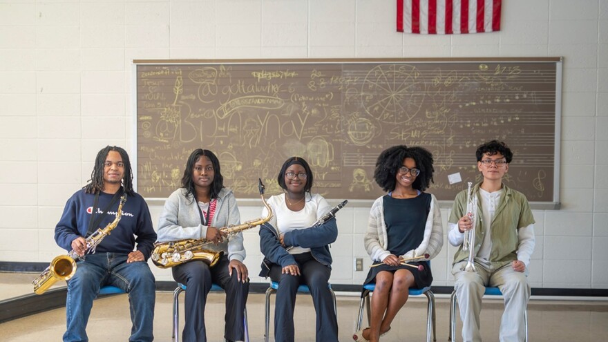 From left: Nick Saunders, Roseneika Saint Jules, Cassietta Lewis, Tennia Gleplay, and Joshua Camero sit for a portrait with their instruments at Arsenal Technical High School on Monday, April 27, 2026, in Indianapolis.