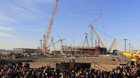 With new construction in the background, President Obama spoke about manufacturing and jobs during a visit to Intel's Ocotillo facility, Jan. 25, 2012, in Chandler, Ariz.
