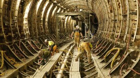 Contractors hired by the Metropolitan St. Louis Sewer District work inside the Deer Creek Tunnel , one of the biggest under Project Clear. The utility is looking for permission to sell $500 million in bonds to fund more Project Clear work, which is required by a 2012 Clean Water Act settlement.