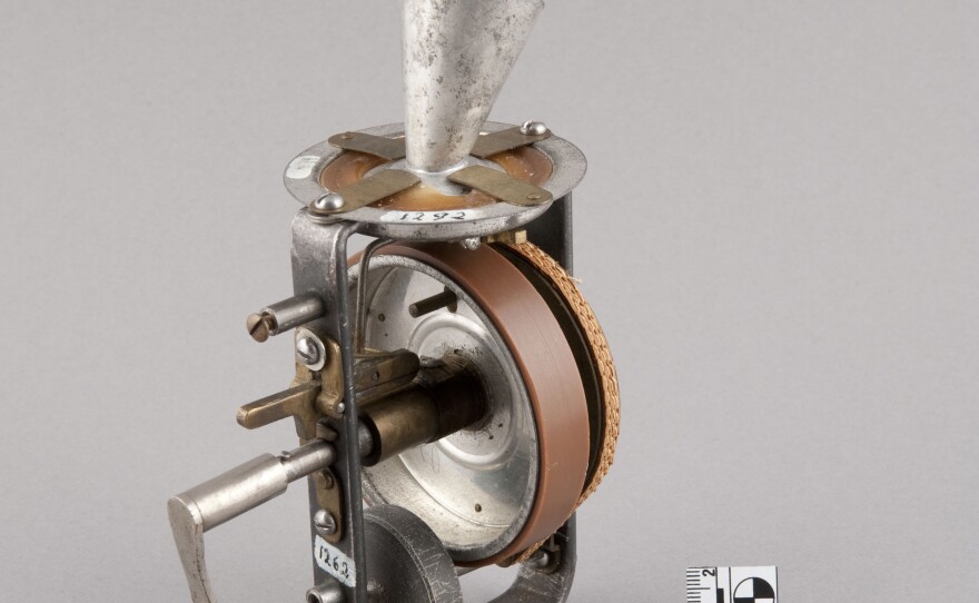 The dolls held a miniature phonograph that was spring-activated by a crank sticking out of the doll's back.