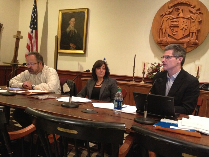 The three selectmen for the town of Weston, Conn., David Muller (left), Gayle Weinstein and Dennis Tracey, hold a town meeting in which they discuss a proposed gun-control ordinance.