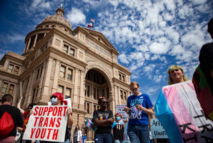 People gathered in front of the Texas Capitol on Tuesday during a protest for transgender kids’ rights. 