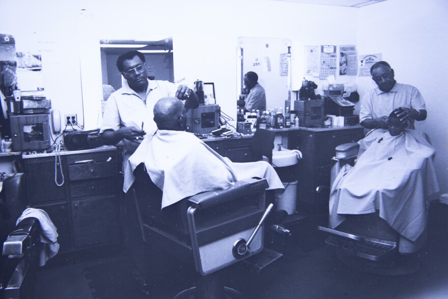 Willie Sells (left) cuts hair next to William Tecumseh (right) in Tee’s Barber Shop when they worked together. Tecumseh was a mentor and father figure to Sells.