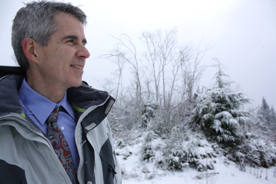 Snoqualmie Mayor Matt Larson stands in front of the property he wanted opened up to development.