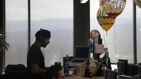 Employees work at their desks in Redwood City, Calif., Monday, Jan. 30, 2017. (Jeff Chiu/AP)