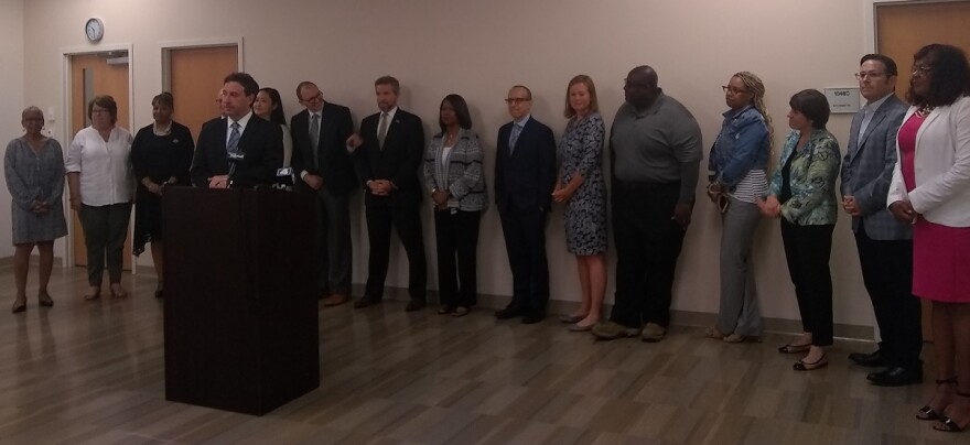 St. Louis County Executive Steve Stenger with members of the new county affordable housing fund task force on June 20.