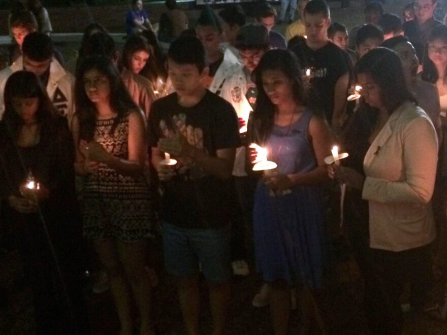 Community members take part in a candlelight vigil in remembrance of Sept. 11.