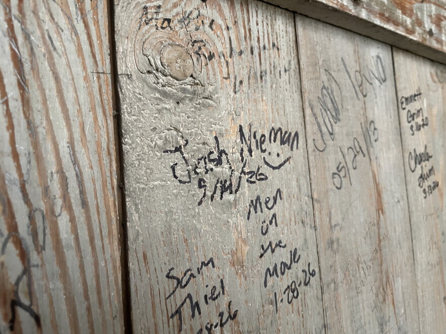 Joshua Nieman's signature on the wall.