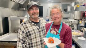 A couple holding an "Alaskan jalapeno popper"