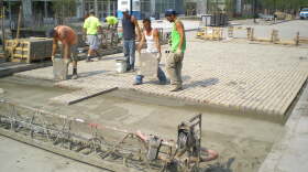 File photo of construction workers restopring Old Falls Street