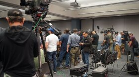 Journalists set up their cameras before a news conference held by the Utah County Attorney’s Office announcing charges against Tyler Robinson in the death of Charlie Kirk, Sept. 16, 2025. News outlets from around the country, and world, were in attendance.