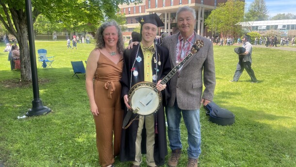 William "Wolfie" Krebs, a Hampshire college graduate part of the Class of '26, with his mom and dad at commencement on Saturday. He played his banjo for folks on the lawn after the ceremony.