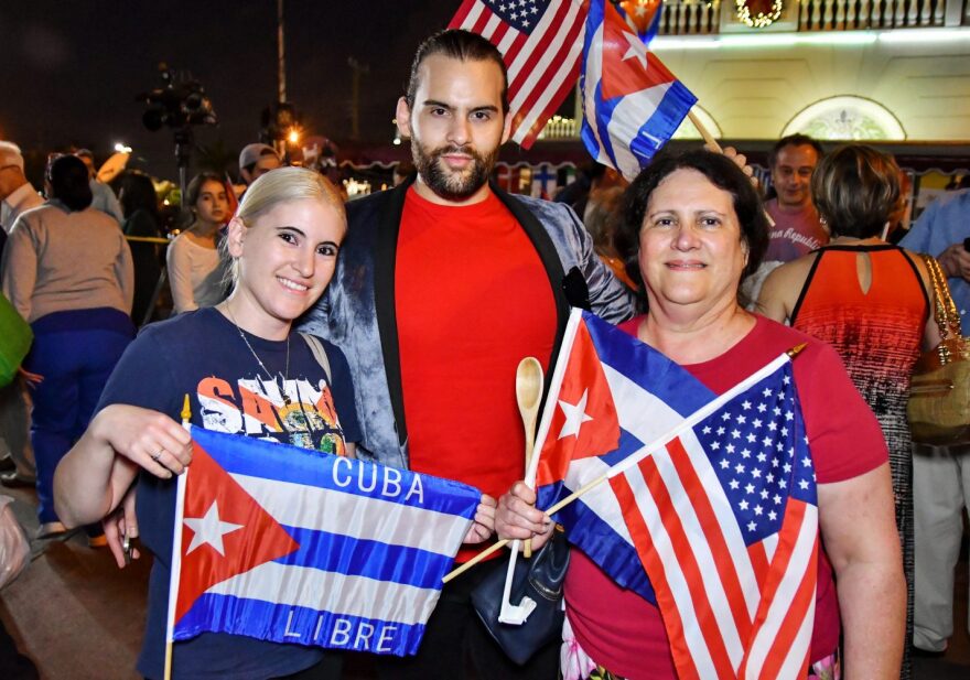 From left to right: Leslie Gonshak, Robert Gonshak, and Lisette Sauleda pose for a picture outside Versaille Restaurant in Little Havana. Sauleda escaped Cuba at age 13 by boarding a plane to Madrid, meeting up with a Spanish priest, and living at a Catholic School run by nuns. (Grace King/ WUFT News)