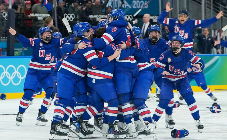 United States players celebrate after a women's ice hockey gold medal game between the United States and Canada at the 2026 Winter Olympics, in Milan, Italy, on Thursday, Feb. 19, 2026.