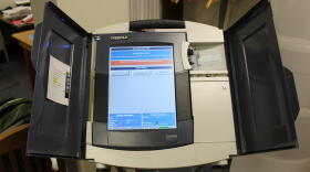 Voters couldn't use voting machines, because computers were unable to log them in as the polls opened at 6 a.m. (STAN JASTRZEBSKI / WBAA NEWS)