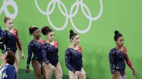 U.S. gymnasts, from right, Gabrielle Douglas, Aly Raisman, Lauren Hernandez, Simone Biles and Madison Kocian walk to the next apparatus during the artistic gymnastics women's qualification at the 2016 Summer Olympics in Rio de Janeiro, Brazil, Sunday, Aug. 7, 2016. (Dmitri Lovetsky/AP)