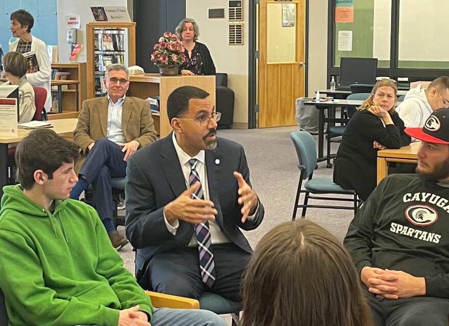  SUNY Chancellor John King speaks with students at Cayuga Community College's Auburn Campus on March 20. 
