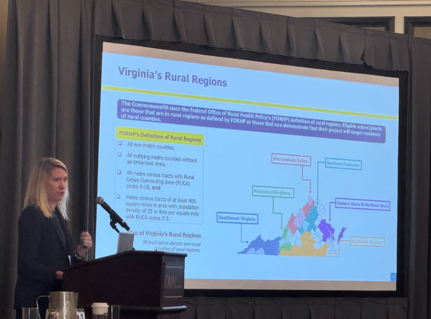 Heidi Hertz, Director of Virginia’s Rural Health Transformation Fund, shows current federally designated "rural" area maps at the Claude Moore Scholars & Regional Healthcare Workforce Meeting Friday morning.