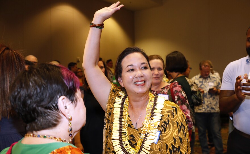 Jill Tokuda, Democratic candidate in Hawaiʻi's 2nd Congressional District, waves during a Democratic gathering on election night Tuesday, Nov. 8, 2022, in Honolulu. Tokuda defeated Republican Joe Akana in the district covering rural Oʻahu and the rest of the Hawaiian Islands. (AP Photo/Marco Garcia)