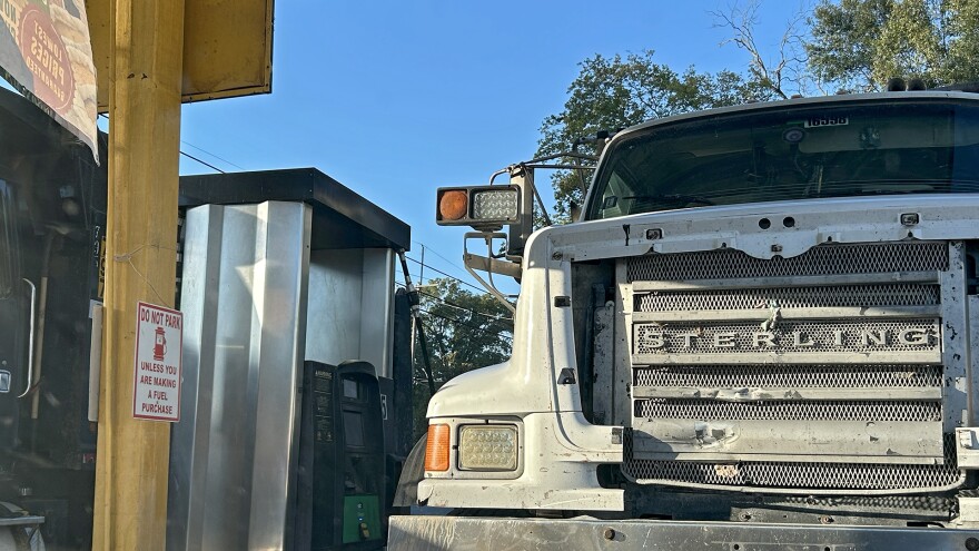 A pair of dump trucks at a gas pump in Delhi, Louisiana, on Thursday, October 16, 2025. Since Meta started construction, traffic has nearly tripled, and crashes around the construction site have increased by more than 600%.