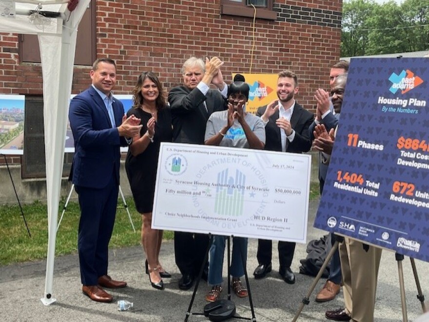 Officials unveil the ceremonial $50 million check July 17, 2024.