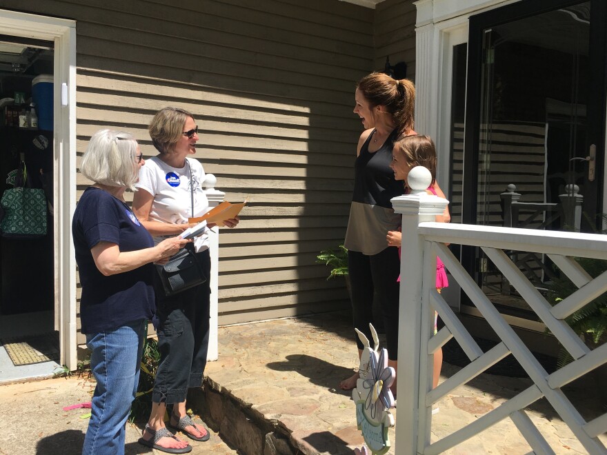 Christina Ferguson and Anna Cay Robertson canvass for Democrat Jon Ossoff ahead of Tuesday's special election in Georgia's 6th District. Megan Tucker tells them she is voting for Ossoff.