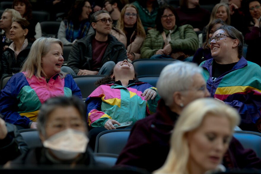 Fans react after being called out for their 90’s attire as Olympic hopefuls compete in the ice dancing competition during the 2026 U.S. Figure Skating Championships at the Enterprise Center on Thursday, Jan. 8, 2026, in St. Louis’ Downtown West neighborhood.