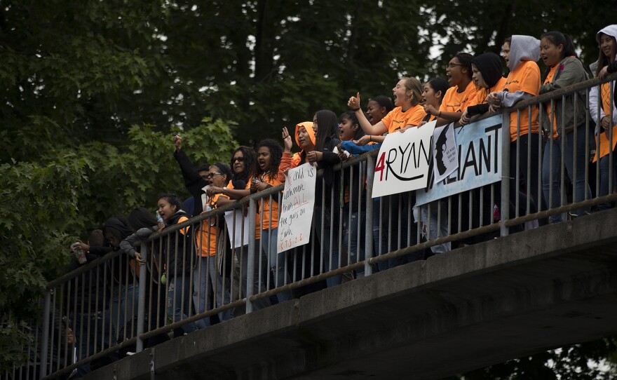 Students gather at the intersection of Rainier Ave. South and Martin Luther King Jr. Way South during a demonstration calling for an end to gun violence on Friday, June 8, 2018, outside of Franklin High School in Seattle. 