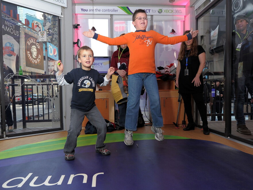 Kids play with the Kinect for Xbox 360 during a launch event in New York City.