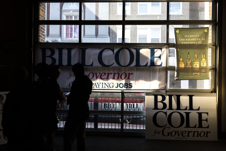 Campaign signs at Bill Cole's stop at Jameson's Bar & Grill in Morgantown.